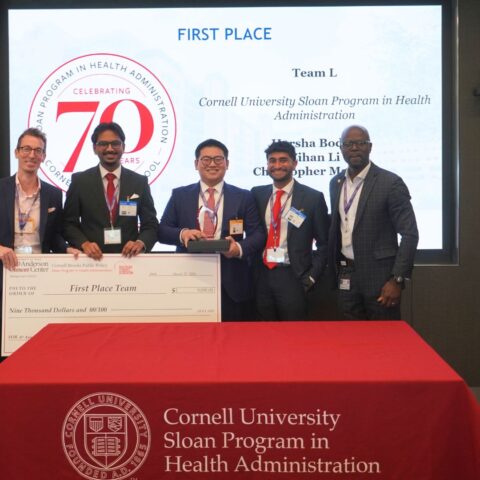 Sloan MHA Faculty Director Professor Michael Richards, team members Harsha Boddu MHA ’27, Tom Li MHA ’27, and Christopher Mathew MHA ’27, and Prince Ampomah, Associate Vice President in the Office of the Chief Physician Executive at MD Anderson Cancer Center, celebrate the Sloan MHA team’s first-place finish at the national health care case competition.