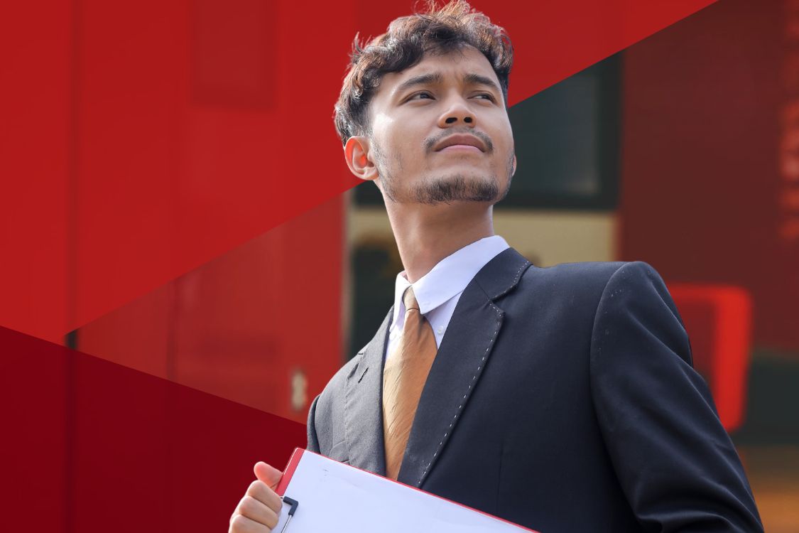 Student wearing suite jacket with red triangle background