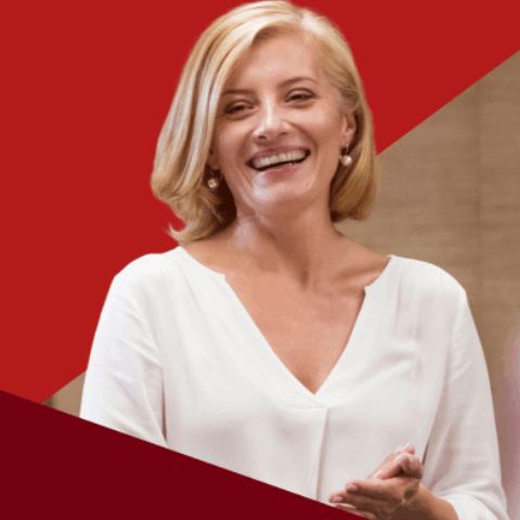 Woman in white shirt, red triangle overal