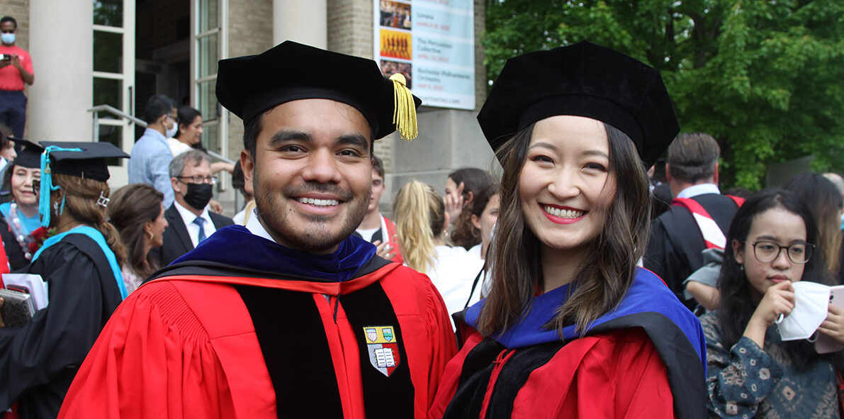 Two PhD students at graduation