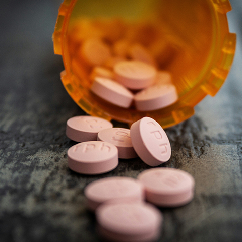 Prescription drugs in orange pill bottle