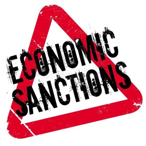 red triangle with stamp of words 'economic sanctions'